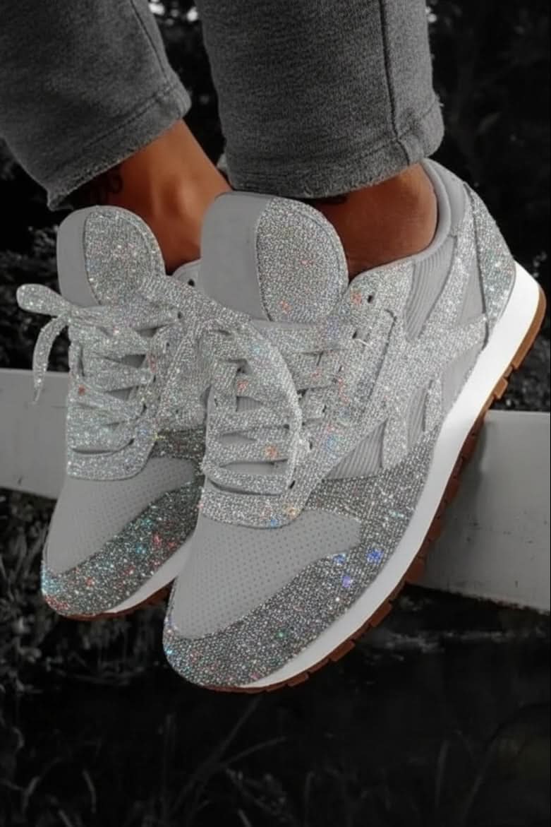 Women's feet in comfy glitter walking shoes, perfect for athleisure & sparkling everyday style.
