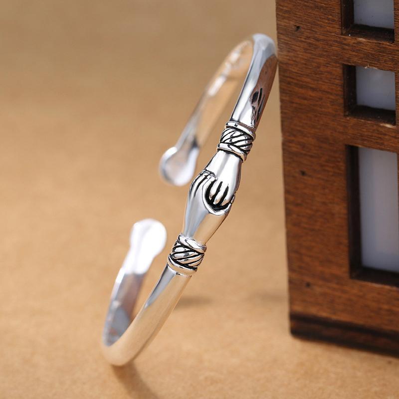 Model wearing an adjustable sterling silver handshake bracelet, ideal for daily wear
