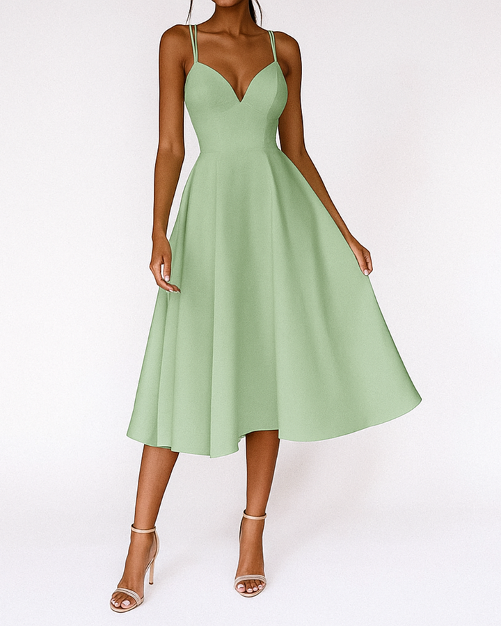 Stylish women's strappy floral print midi dress, versatile event wear for spring or summer weddings.