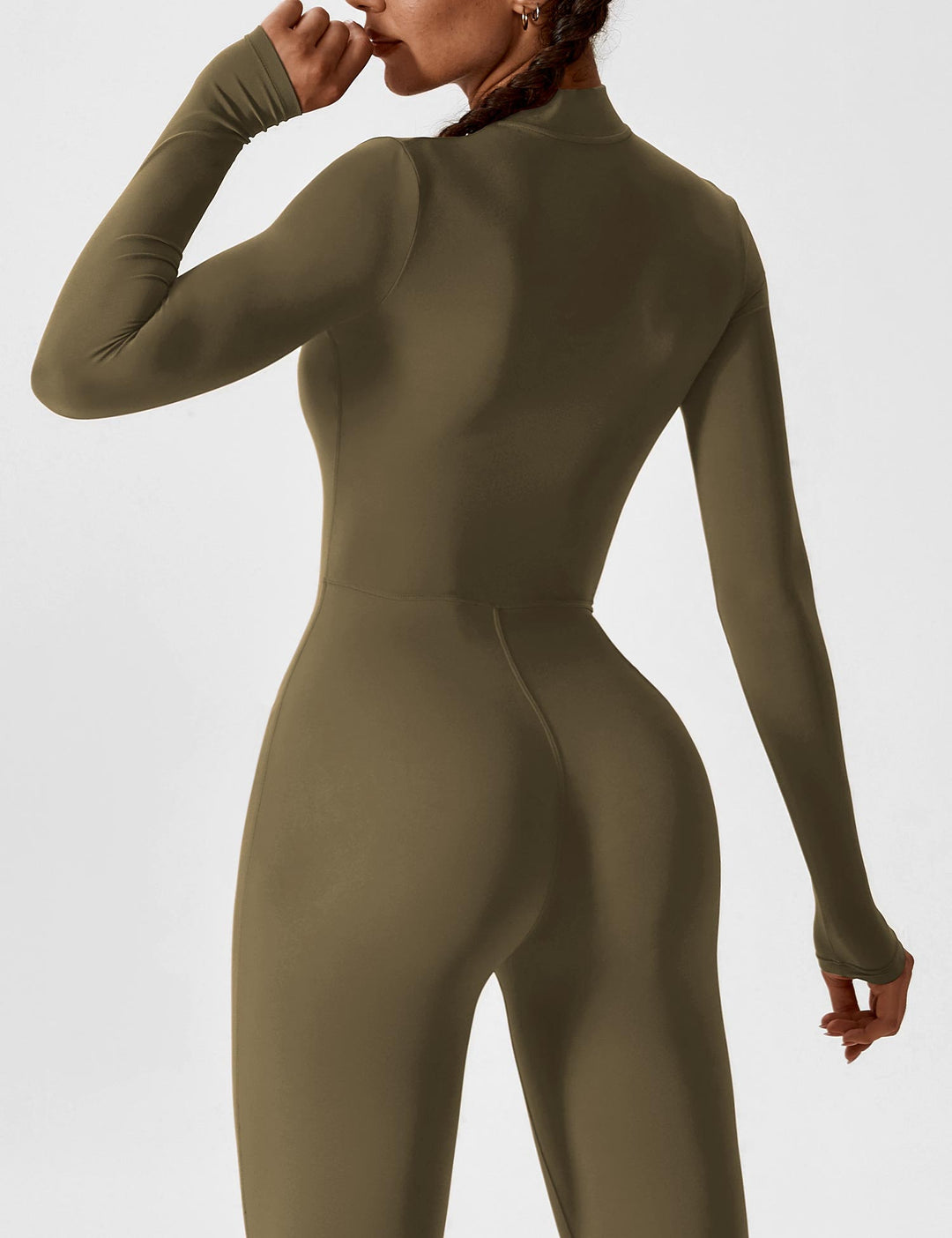 Stretchy women's jumpsuit in a solid color, featuring a practical zipper, a versatile spring staple