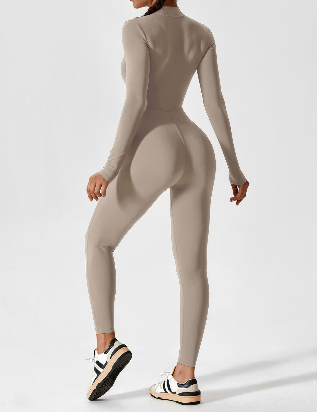 Fashionable women's stretchy jumpsuit, perfect for spring layering with its versatile zip-up design