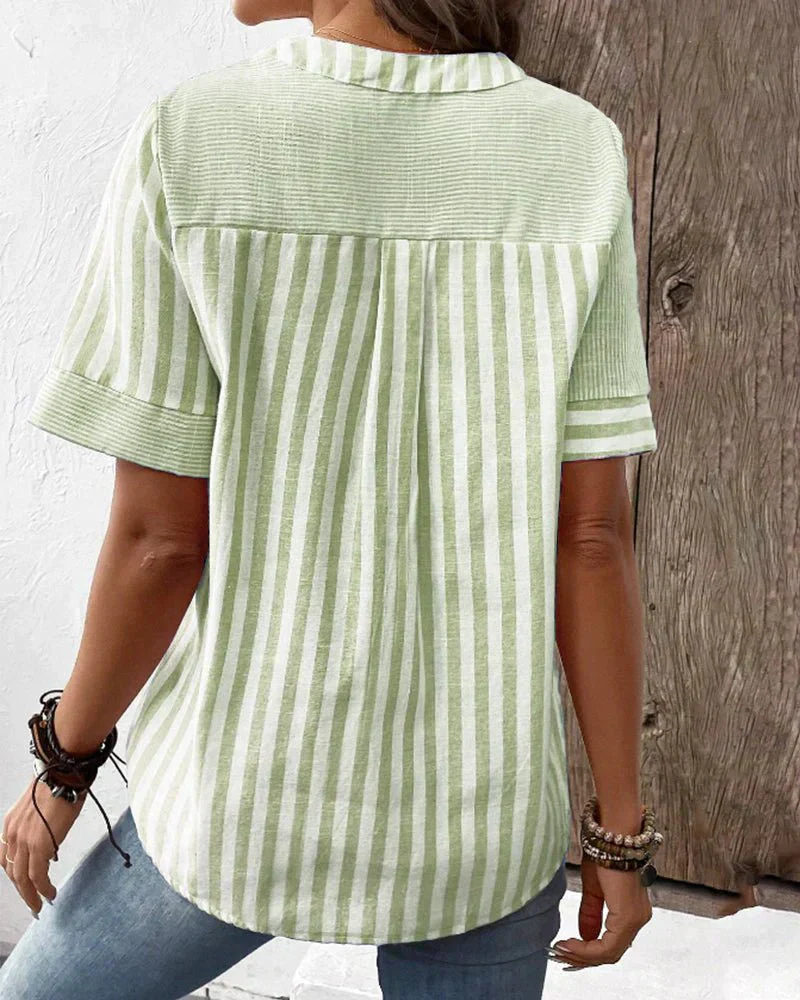 Comfortable women's short sleeve striped & colorblock shirt, offering an effortless chic and stylish appeal.