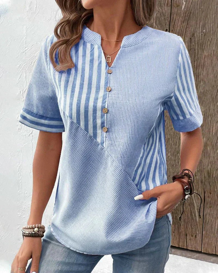 Chic women's half-button blouse in a striped colorblock pattern, short sleeves, perfect for everyday style.