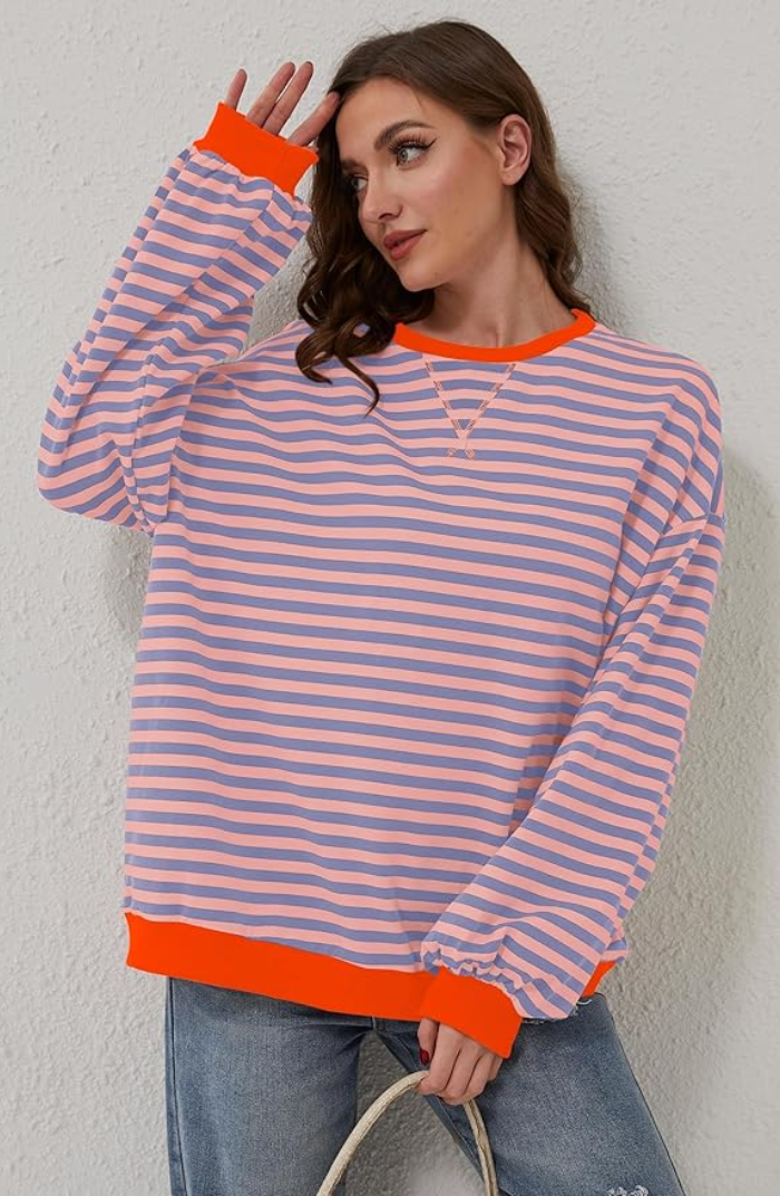 Close-up of a women's striped spring knit sweater showing the soft fabric texture