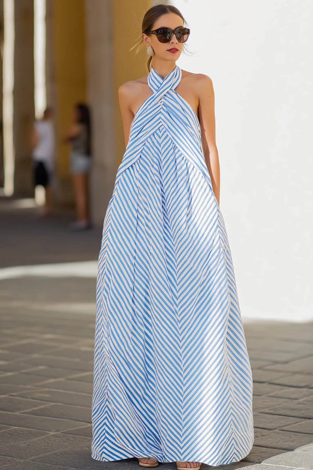 Stylish striped A-line maxi dress for women, featuring a halter neck, perfect for summer beachwear.