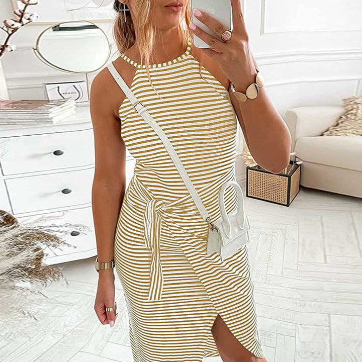 Sleeveless women's striped dress featuring a halter neck, ideal for summer casual wear.