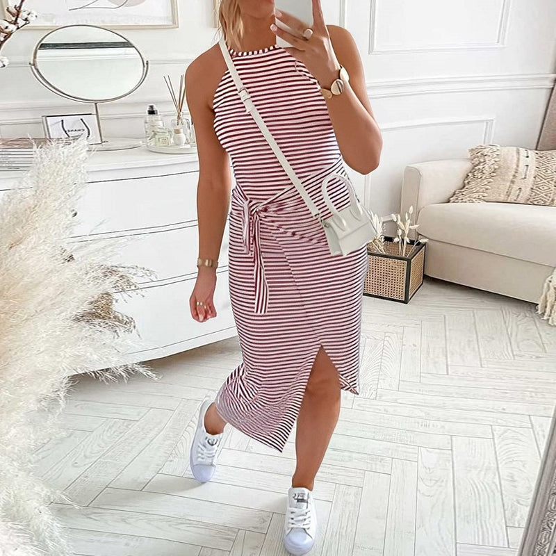 Full shot of a women's halter neck striped dress, a stylish and comfortable summer fashion choice.