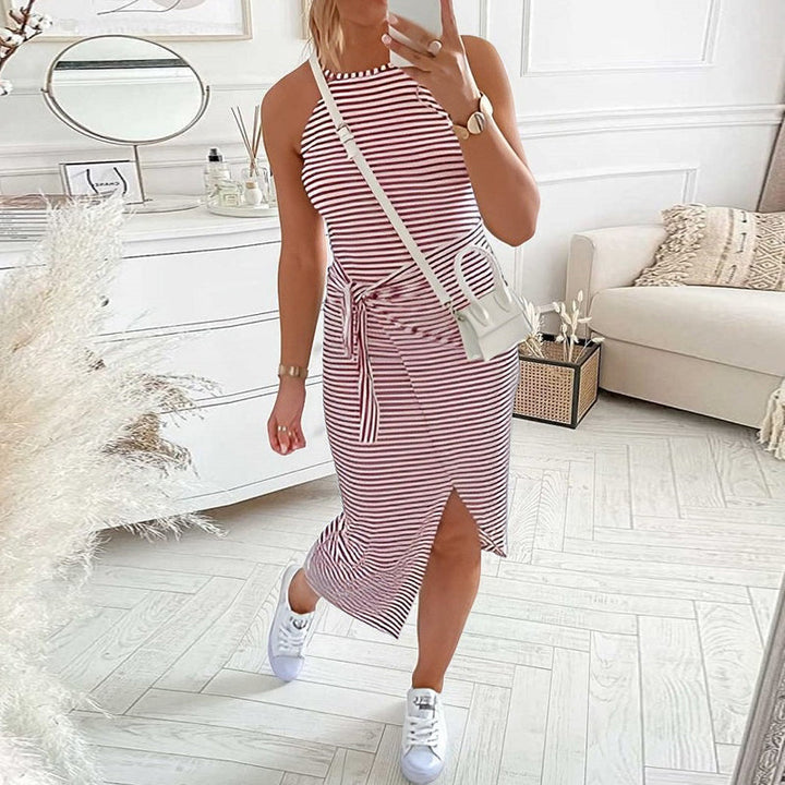Full shot of a women's halter neck striped dress, a stylish and comfortable summer fashion choice.