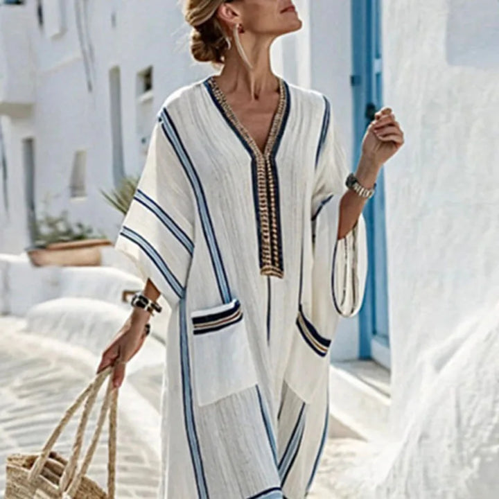 Flowy striped kaftan dress for women, ideal as comfortable summer beachwear or casual vacation resort wear.