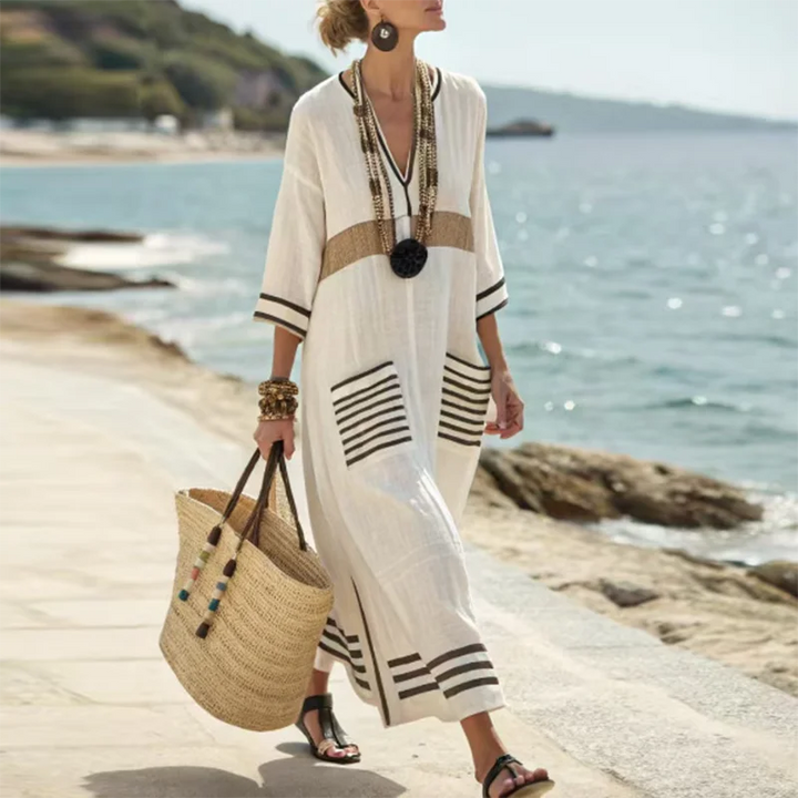 Effortless women's striped kaftan dress, a flowy maxi perfect for summer beach days, vacation, and resort wear.