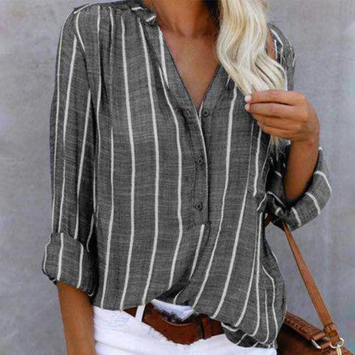 Elegant women's striped button-down V-neck shirt. Perfect long sleeve top for everyday chic fashion.