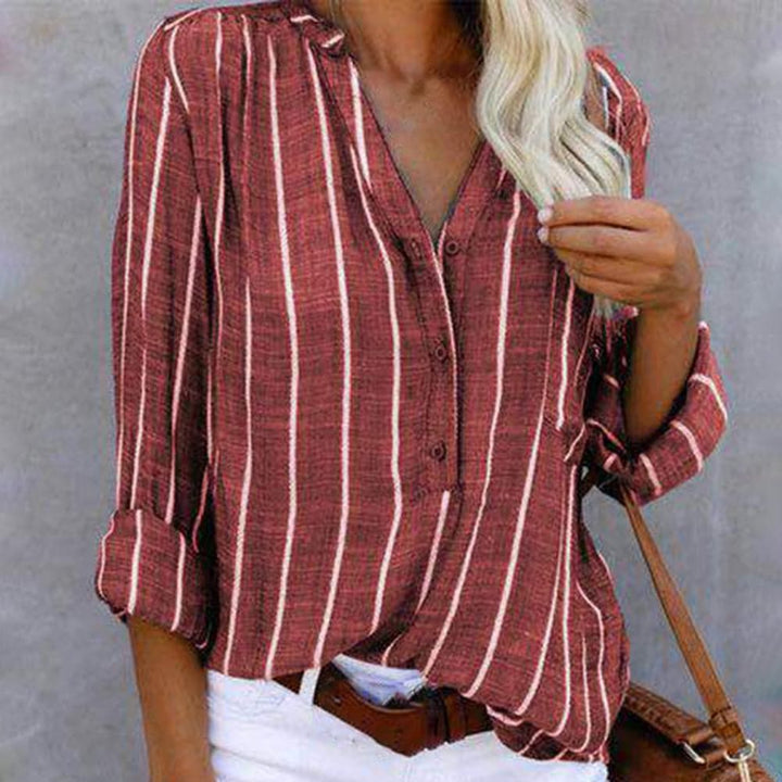 Casual women's striped long sleeve blouse featuring a stylish V-neck and functional roll-tab sleeves.
