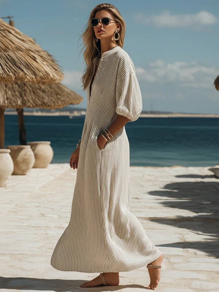 Striped V-neck maxi dress for women, showcasing trendy puff sleeves and a button-down design.