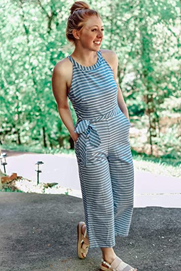 Versatile women's striped wrap neck jumpsuit with wide legs, suitable for elegant or casual occasions.