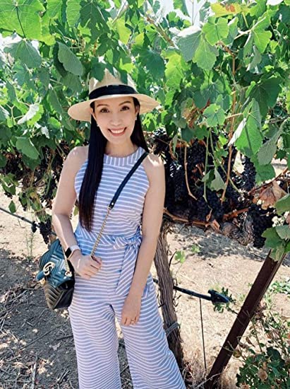 Modern women's striped wide leg jumpsuit, a chic sleeveless one-piece for sophisticated summer apparel.