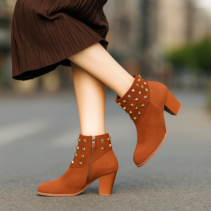 Side view of women's studded ankle boots. Block heel, side zip, perfect for casual chic outfits.