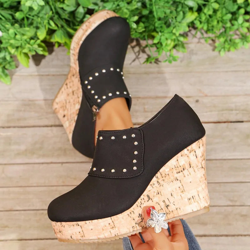 Detail shot of the textured cork sole on Women's Studded Wedge Sandals for good grip