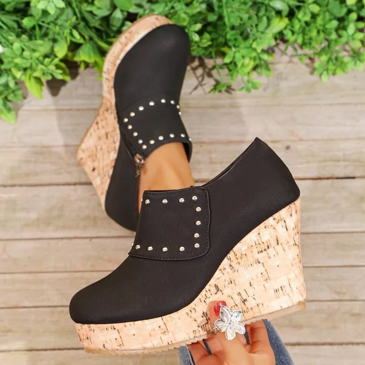 Detail shot of the textured cork sole on Women's Studded Wedge Sandals for good grip