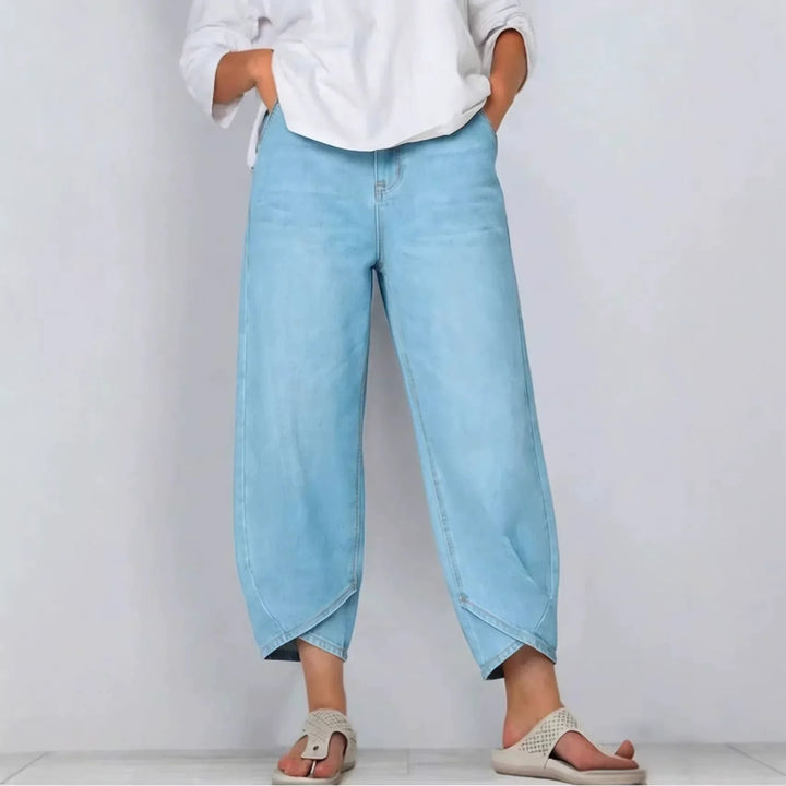 Textured denim women's barrel leg cropped jeans, mid-rise with a modern, curved silhouette.