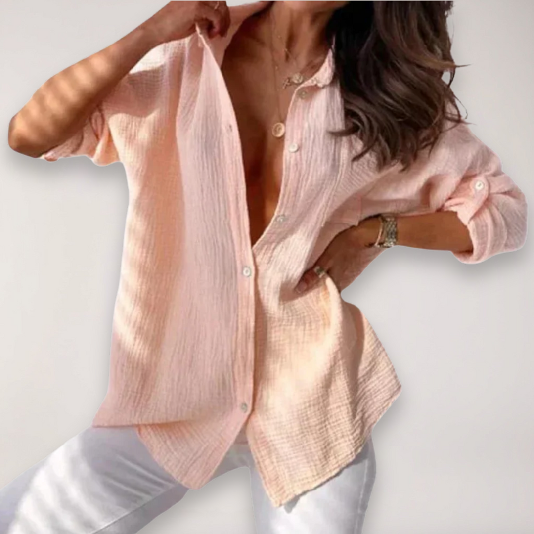 Women's stylish button-front blouse with versatile roll-up long sleeves, perfect for casual or office wear.