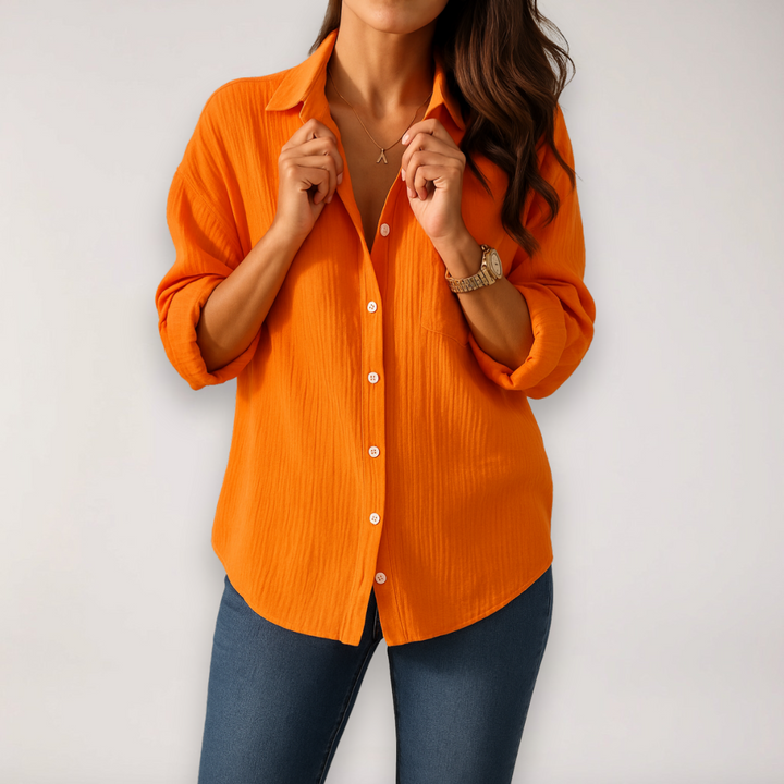 Chic women's button blouse, comfortable for everyday fashion. Features stylish roll-up sleeves and versatile design.