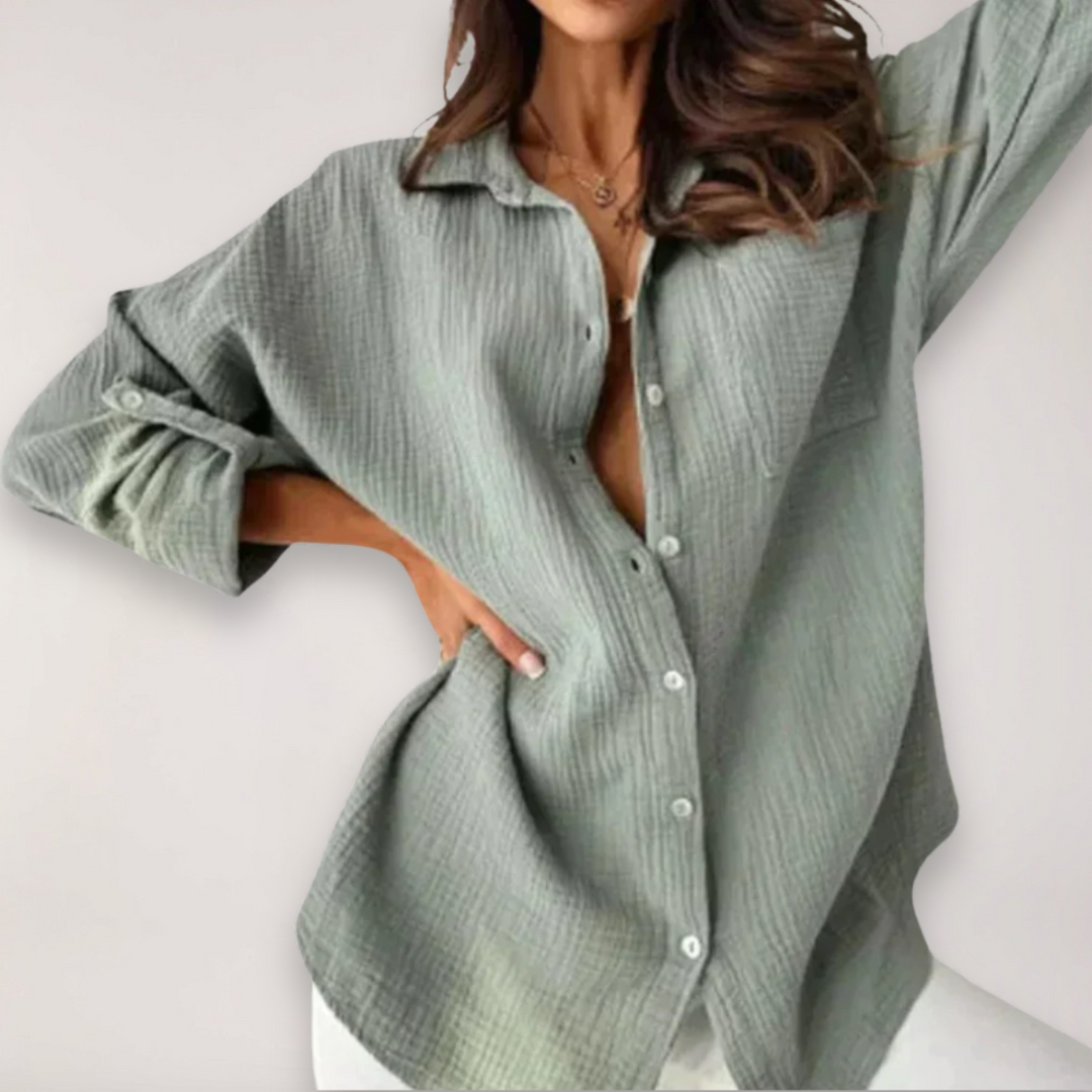 Elegant women's button-front top with roll-up long sleeves. Ideal for office wear, casual outings, and everyday style.