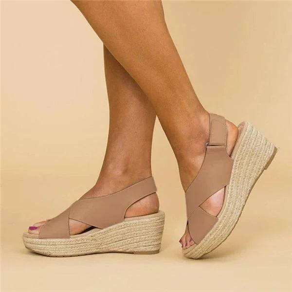 Women's stylish espadrille wedge sandals with ankle strap, perfect for summer comfort.