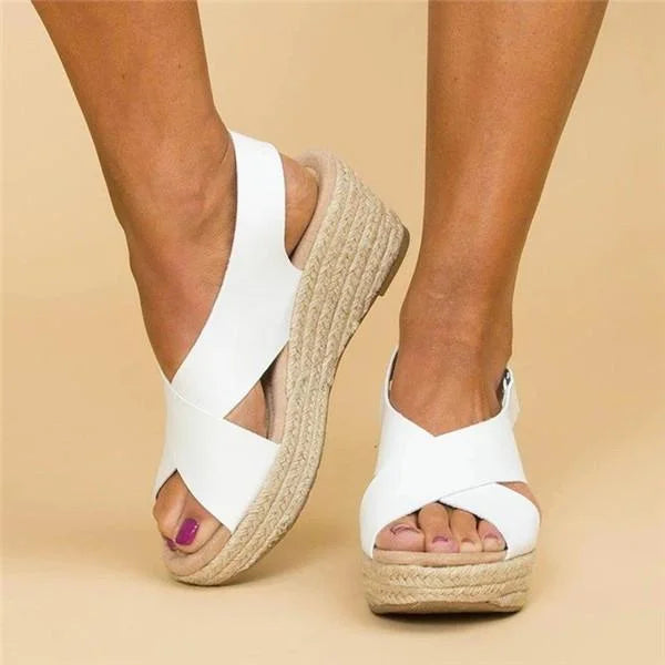 Vacation-ready women's espadrille wedge sandals, offering stylish comfort with an ankle buckle.