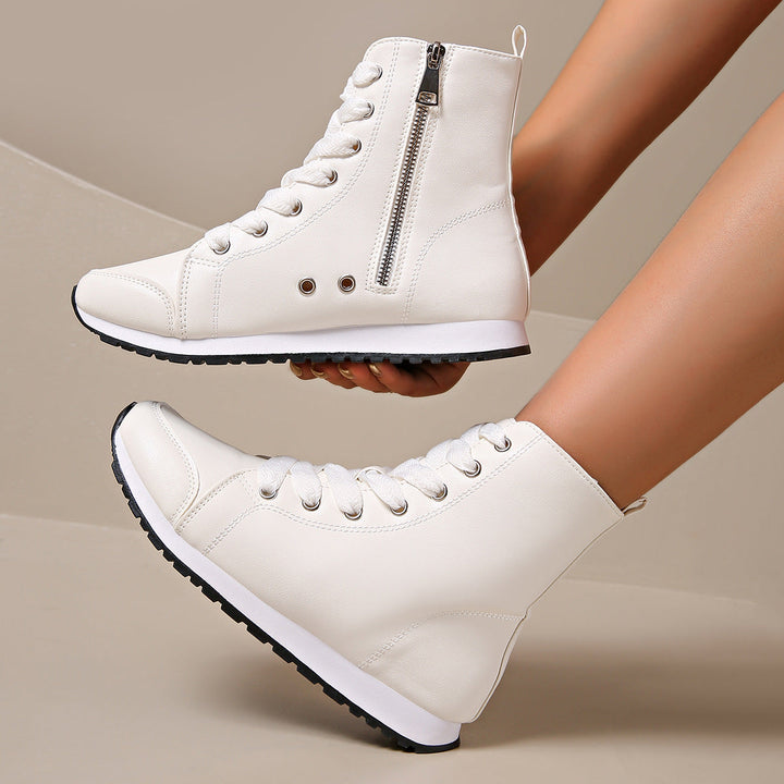 Close-up of women's high-top orthopedic sneakers, highlighting stylish design, comfort features, and durable build.
