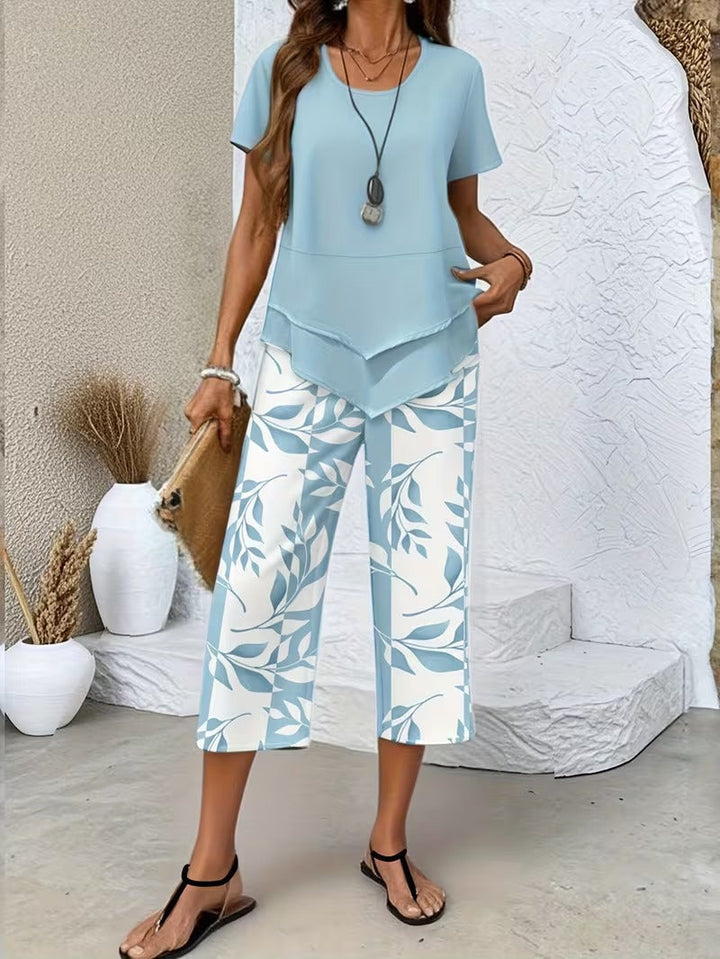 Effortless women's leaf print matching set with relaxed fit pants, perfect for casual summer fashion.