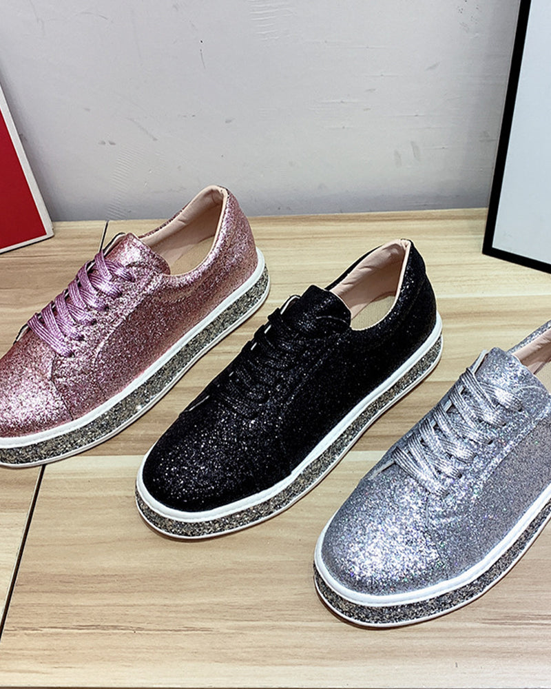 Close-up of women's sparkling glitter platform sneakers, designed for style, comfort, and versatile wear.