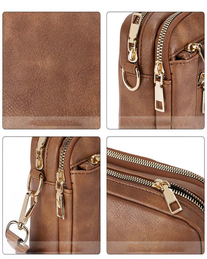 Detail of the zipper closure on a women's black PU leather fashion crossbody handbag