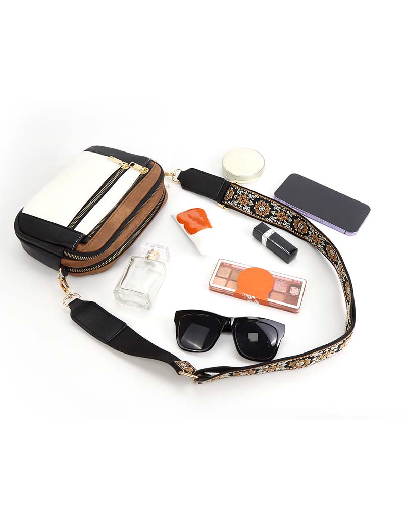 Black PU leather women's crossbody bag with subtle embroidered pattern, ideal for fashionistas