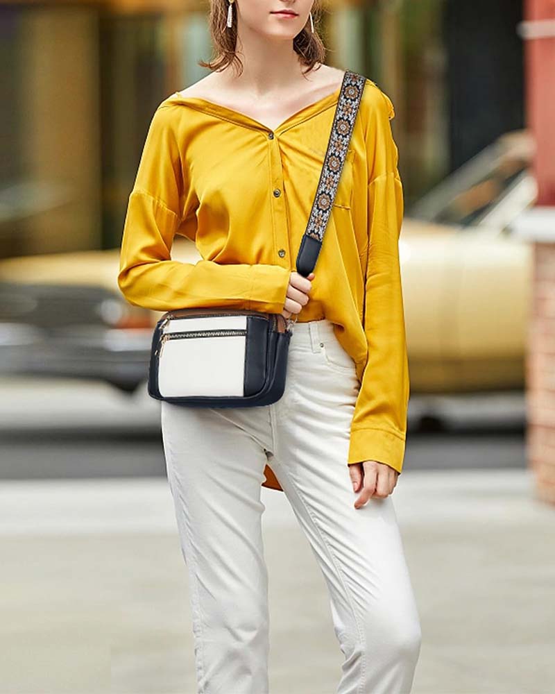 Travel-friendly women's black PU leather crossbody bag, featuring a comfortable adjustable strap