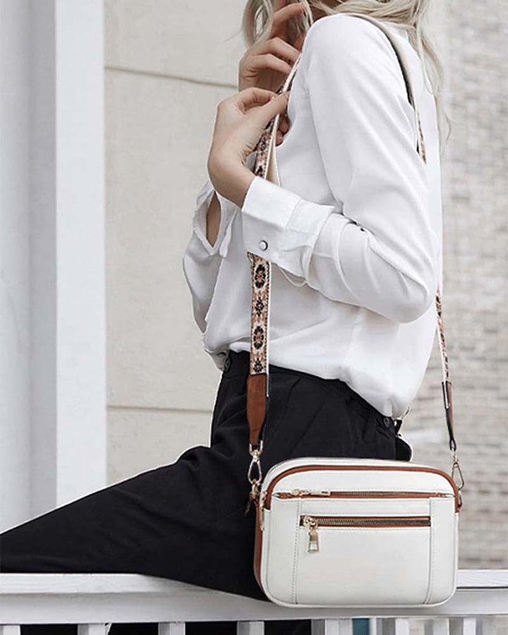 Fashionable women's crossbody shoulder bag in classic black, PU leather, with embroidered detail