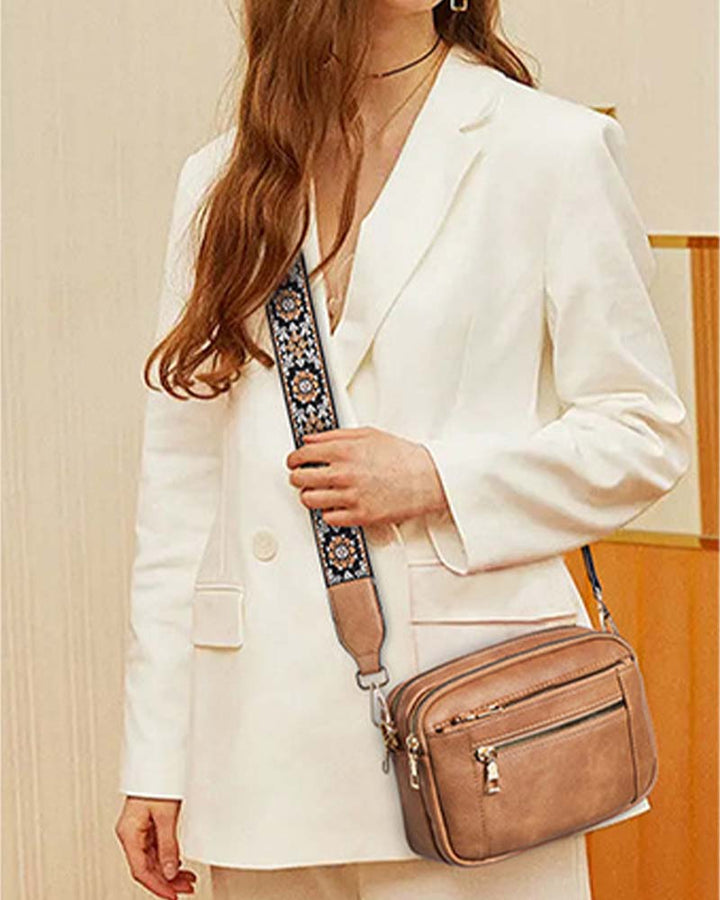 Elegant black PU leather crossbody bag for women, perfect for travel or business, adjustable strap