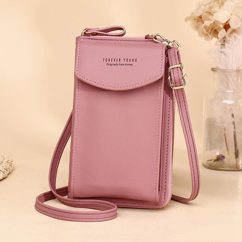 Stylish women's wallet pouch, worn across the body, demonstrating hands-free convenience
