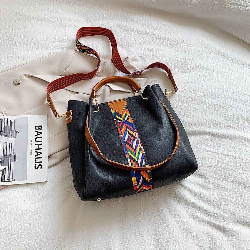 Versatile PU leather tote bag for women, suitable for work, travel, & daily use.