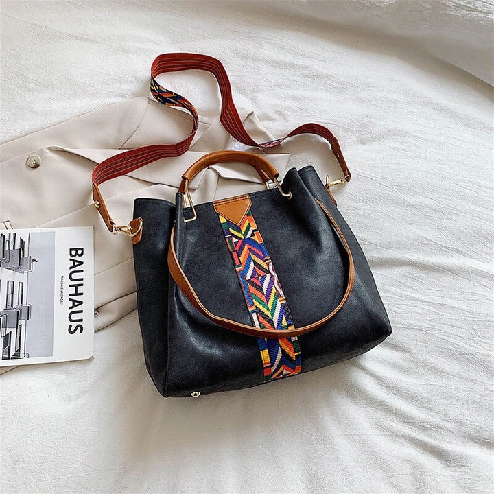 Versatile PU leather tote bag for women, suitable for work, travel, & daily use.