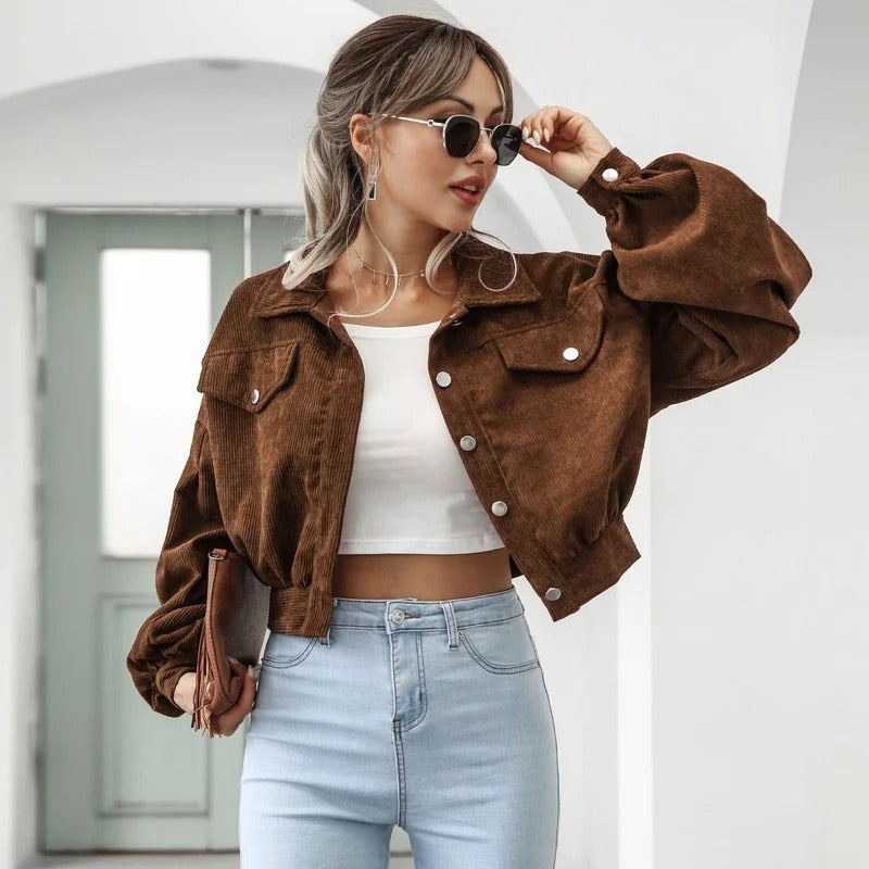Versatile women's short denim jacket with puff sleeves, ideal for casual outfits & summer layering.