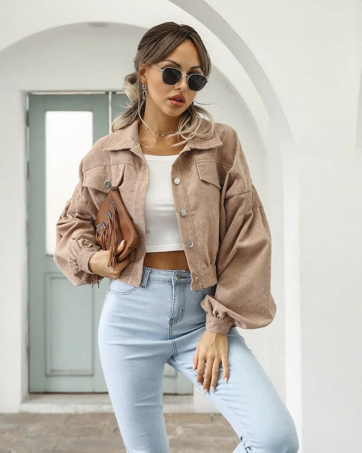 Women's cropped puff sleeve jacket in a short style, 'Amira,' offering a modern, casual look for fashion-forward women.