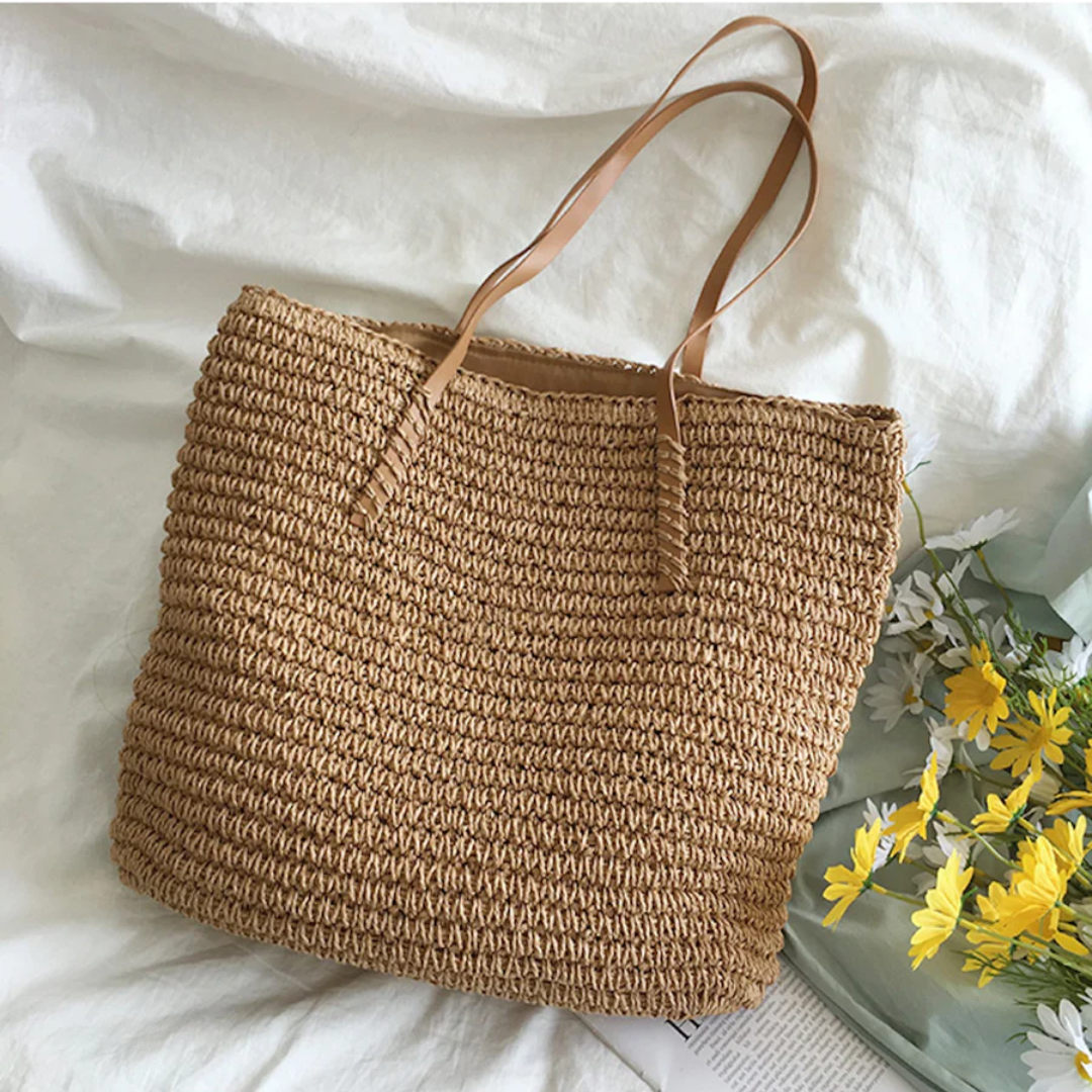 Durable white woven shoulder bag, a chic and spacious tote for women.