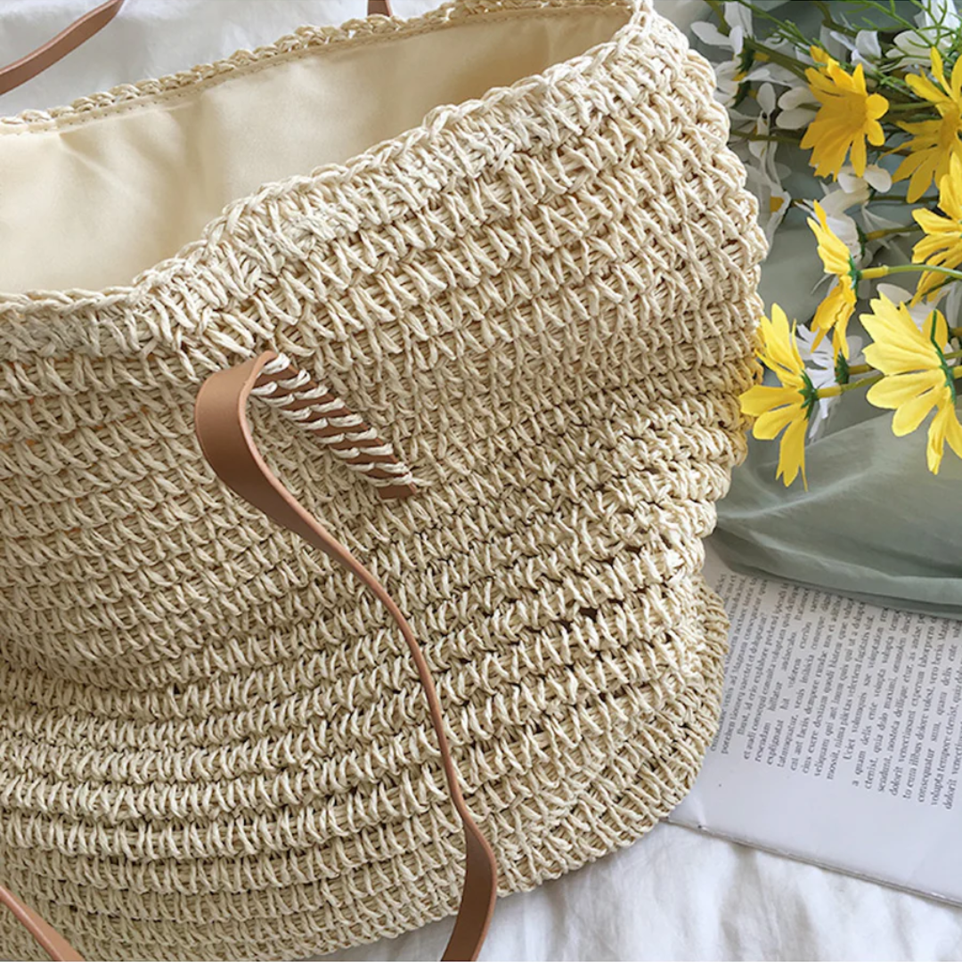 Practical women's daily essential: a durable and spacious shoulder bag with elegant woven details.