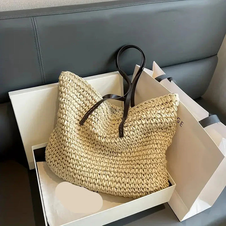 Versatile women's straw tote bag, stylish for beach, travel, and casual summer activities.
