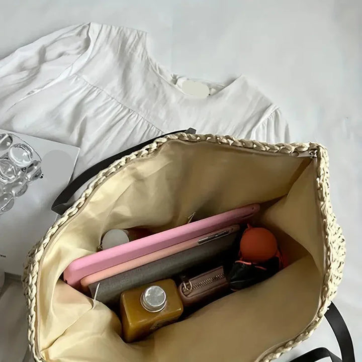 Chic women's woven straw tote bag, a large and elegant choice for beach & summer travel.