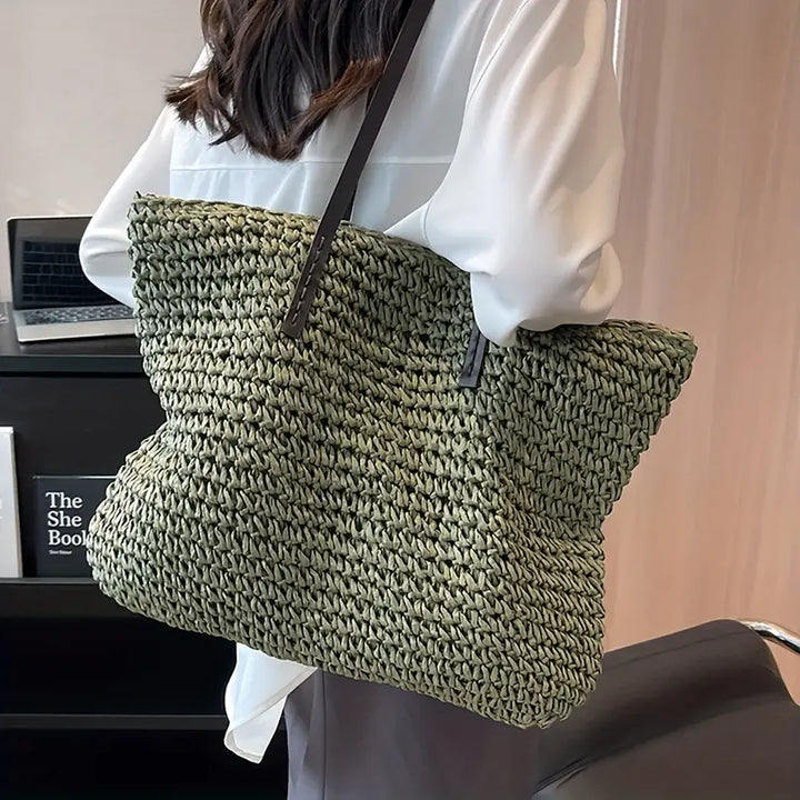 Large woven straw tote bag for women, ideal for beach trips, summer, and travel.