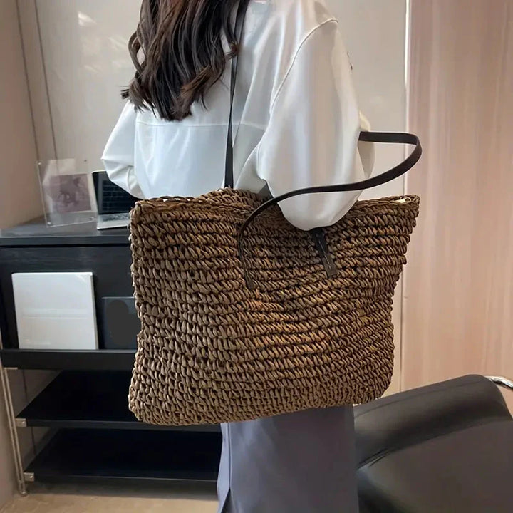 Women's casual straw shoulder tote bag, large and perfect for beach holidays and summer travel.