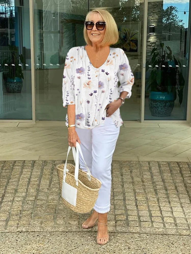 Plus size women's three-quarter sleeve V-neck blouse, an elegant printed top for spring & summer style.