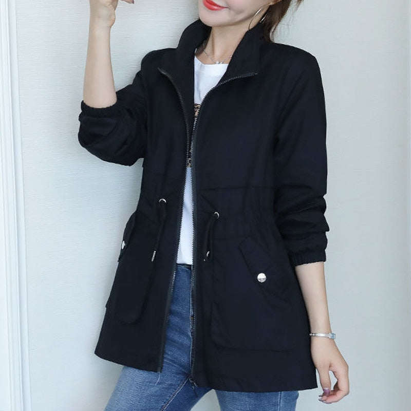Feminine fall jacket, a solid color transitional piece with zipper closure for versatile everyday wear.