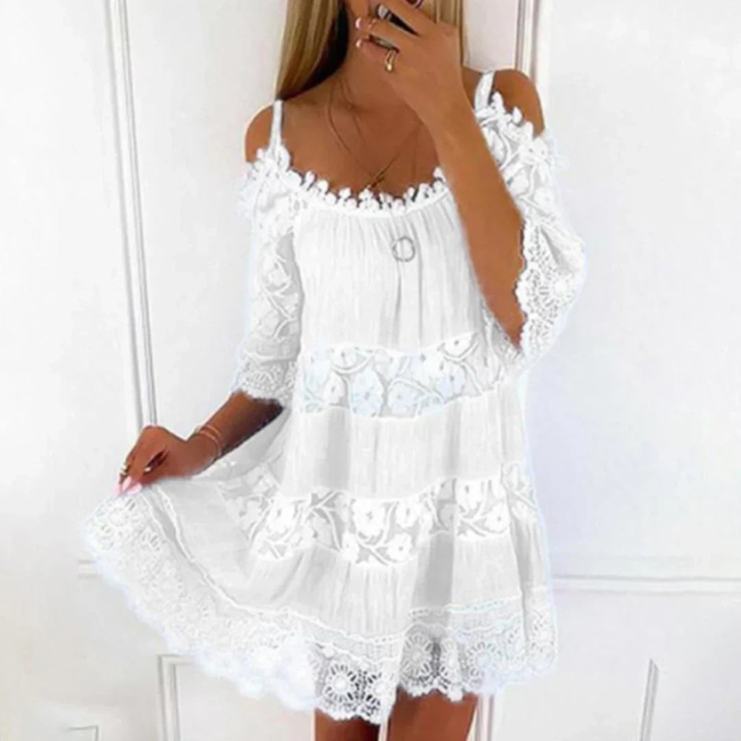 Women's elegant embroidered mini dress for summer vacation, featuring cold shoulder design and delicate crochet lace accents.